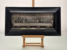 A 20thc School, white metal impression of - The Last Supper in a wooden frame. (11.5cmx30.5cm)