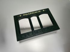 A modern French wall hanging medicine cabinet in the style of a traditional pharmacy, bearing '
