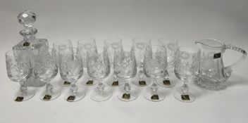 A set of twelve Margaret handcut lead crystal glasses with etched sunflowers to bowl and knopped