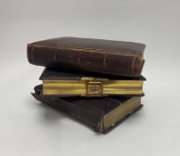 A collection of three leather-bound Victorian period photograph albums, one containing a series of