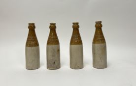 A collection of four 'W.M Murray & Co Craigmillar Brewery, Edinburgh' two-tone stoneware beer