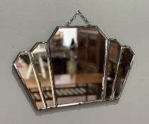 An Art Deco ladies fan shaped bevelled edge hall mirror. (31cmx50cm)