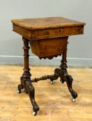 A Victorian burr walnut sewing table with hinged top enclosing a fully fitted interior, in
