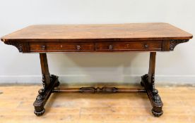 A William IV rosewood library table, the rectangular top with rounded angles, fitted two frieze