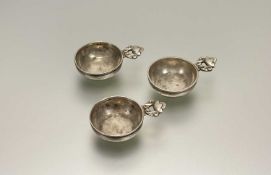Georg Jensen, a set of three Danish sterling silver salts, Acorn pattern (lacking liners). Length