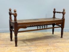 An Edwardian Scottish country house walnut hall bench with twin turned acorn mounted end supports