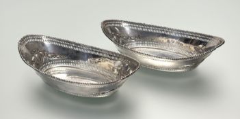 A pair of late Victorian silver navette-form baskets, Henry Matthews, Birmingham 1900, in late