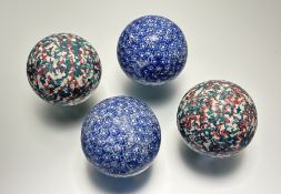 A group of four Scottish pottery carpet bowls, 19th century, comprising: a pair, sponged in green