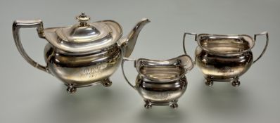 A George V silver three piece tea service, Atkin Brothers, Sheffield 1916, in the Regency taste,