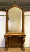 A Victorian oak Gothic revival pier glass and console table in the Scottish Baronial style, the