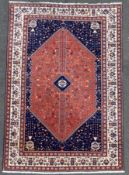 A hand-knotted Persian Abadeh rug, with large hexagonal diamond medallion featuring stylized birds