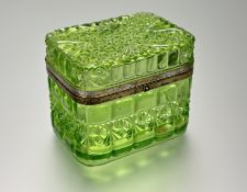 A late 19th/early 20th century Russian moulded gilt-metal mounted green glass box, oblong, decorated