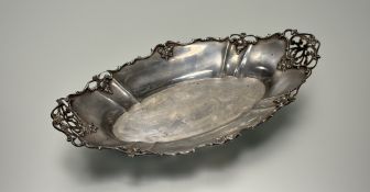 A Gorham sterling silver navette-form basket, late 19th century, the scroll-cast rim and reticulated