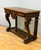 A Victorian oak hall table, the scalloped frieze with cartouche, raised on carved scroll paw feet,