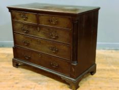 A George III Cuban mahogany chest of small proportions, with crossbanded top, fitted two short and