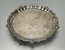 A Victorian silver salver, R & S Garrard & Co., London 1886, the scalloped rim enclosing a well