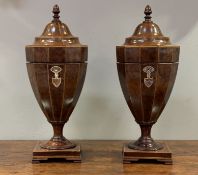 A pair of George III style mahogany and satinwood strung knife urns, circa 1900, each with a