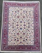 A hand-knotted Persian Kashan/ Mashad carpet, central panel with allover palmette and scrolling