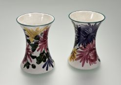 Wemyss Ware, a pair of small beaker vases in the Chrysanthemums pattern, painted mark. Height 11.