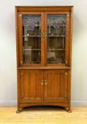 Gardner & Son, Glasgow, an Arts & Crafts upright bookcase, with pull out book rest to top above a