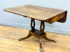 A Regency mahogany sofa table of traditional form, with ebony strung frieze to sides, fitted