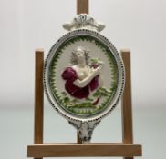 A Pratt Ware wall plaque of Pomona, late 18th century, polychrome painted. Length 20.5cm