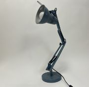 A modern metal anglepoise lamp enamelled in duck egg blue, raised on a circular base (h.
