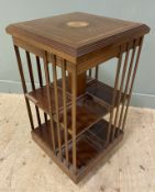A reproduction Edwardian-style mahogany revolving bookcase, with square banded top and inlaid