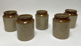 A collection of five two-toned stoneware storage jars of cylindrical form (h. 19.5cm) (5)