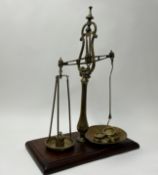 A set of large Victorian Avery of Birmingham weighing scales, raised on a wooden base (h. 67cm)
