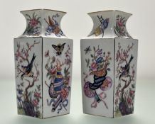 A pair of late 19thc continental square tapered vases, with moulded chinese panel scenes, with