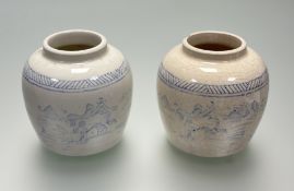 A pair of 19thc Chinese ginger jars, in a white crackle glaze with colboart blue decoration
