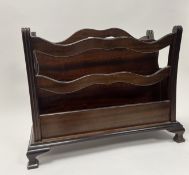 A Mid-Century mahogany magazine rack with two compartments and cut out handle to top (w. 54cm x h.