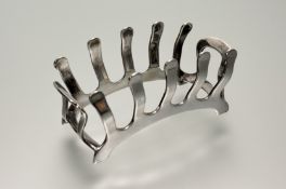 A Birmingham silver arched four division breakfast tray toast rack: h. x 4.5cm l. x 10cm