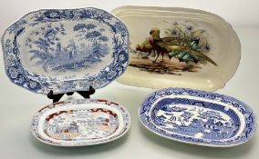 A collection of various serving dishes comprising, a blue and white 