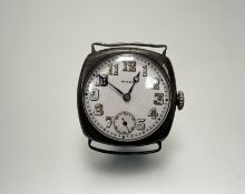 A vintage Rolex silver cased wristwatch with white enamel dial and Arabic numerals and seconds