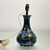 A Mid-Century decorative table lamp in bottle form with mottled blue, brown and yellow glaze, with a