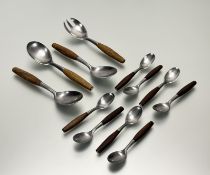 A collection of Dansk design German stainless steel flatware to include a pair of serving spoons: l.
