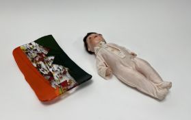A late 19th/early 20thc Armand Maiseille German bisque-headed doll in a cream sleep suit (l. 33cm) ,