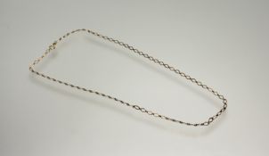 A 9ct gold diamond-shaped chain link necklace with ring fastening: l. x 25cm 4g