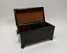 A 19thc stained wooden tea caddy with hinged lid revealing fitted interior, complete with brass