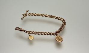 A 9ct gold cast curb link cahoin bracelet with T bar and lobster claw fastening with a charm of