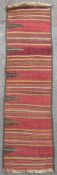 A hand-knotted Turkish kilim runner, composed of horizontal stripes and coloured bands, with