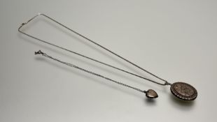 A modern Birmingham silver Edwardian style oval silver locket with leaf-engraved front, Birmingham