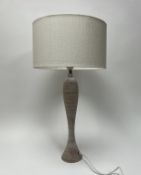 A limed wooden table lamp with fluted base, complete with a brushed linen cream lamp shade of drum