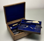 An Edwardain oak canteen constaing a part suite of forty epns flatware for six palce settings to