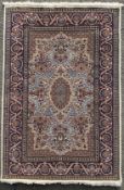 A finely knotted Persian Kashan rug, central medallion surrounded by densely decorated floral