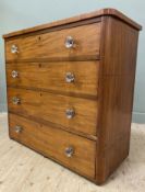 An Edwardian mahogany chest of drawers, fitted four graduated long drawers with later handles,