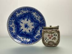 A decorative blue and white ceramic dish decorated in a delft style (w-31.5cm) together with a