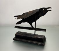A Ramsay Gillies, Folk Art - A sheet metal weathervane of a black crow, raised on a stepped wooden
